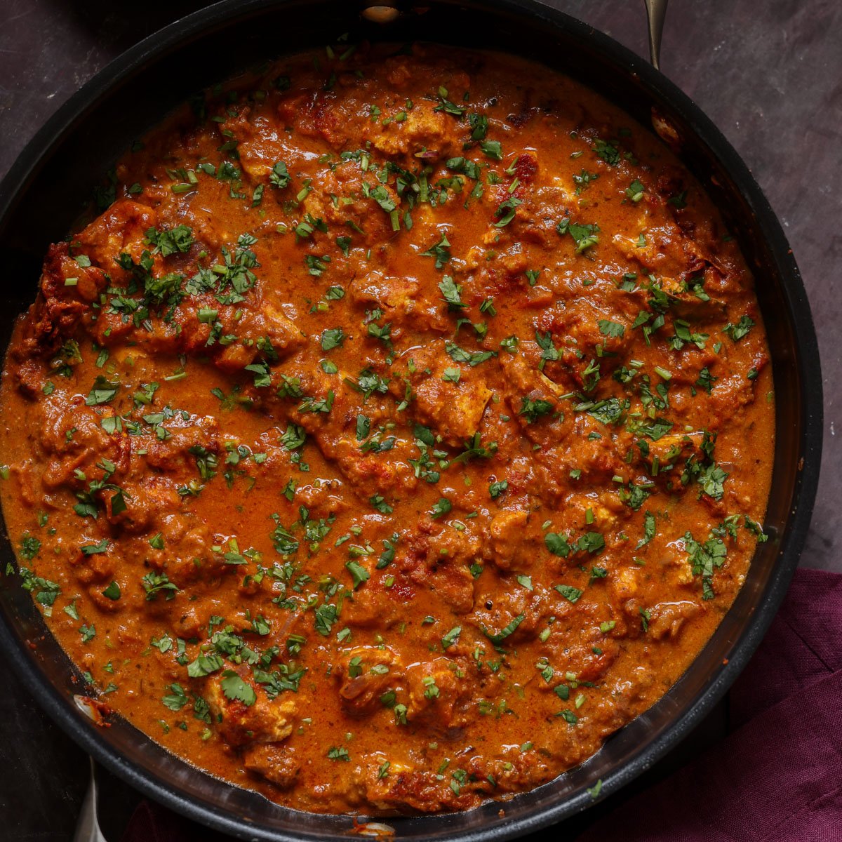 chicken angara in the pan with garnishes