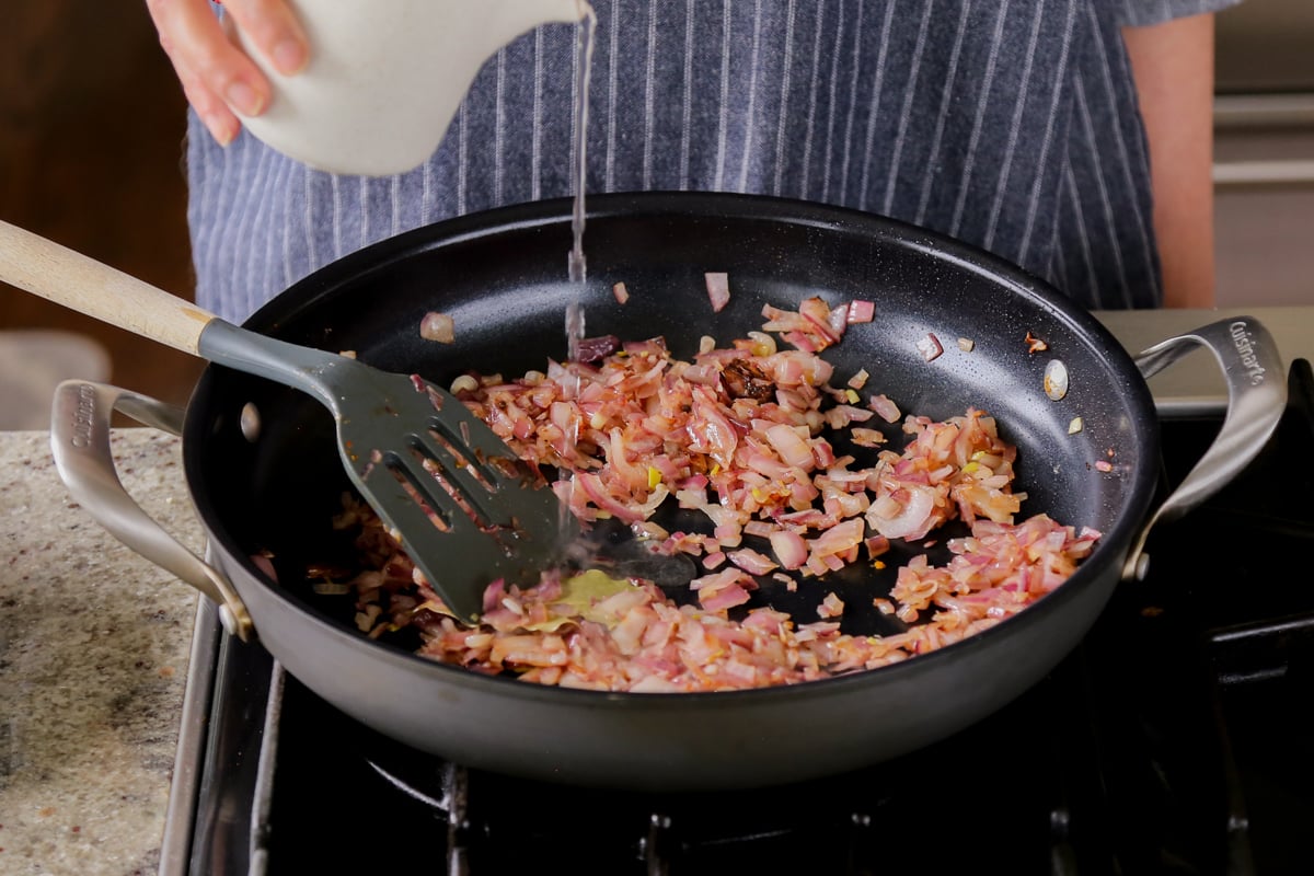 adding water to the onion to help it brown evenly