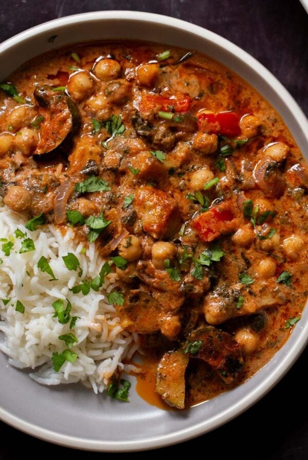 chickpea zucchini curry in a bowl with rice