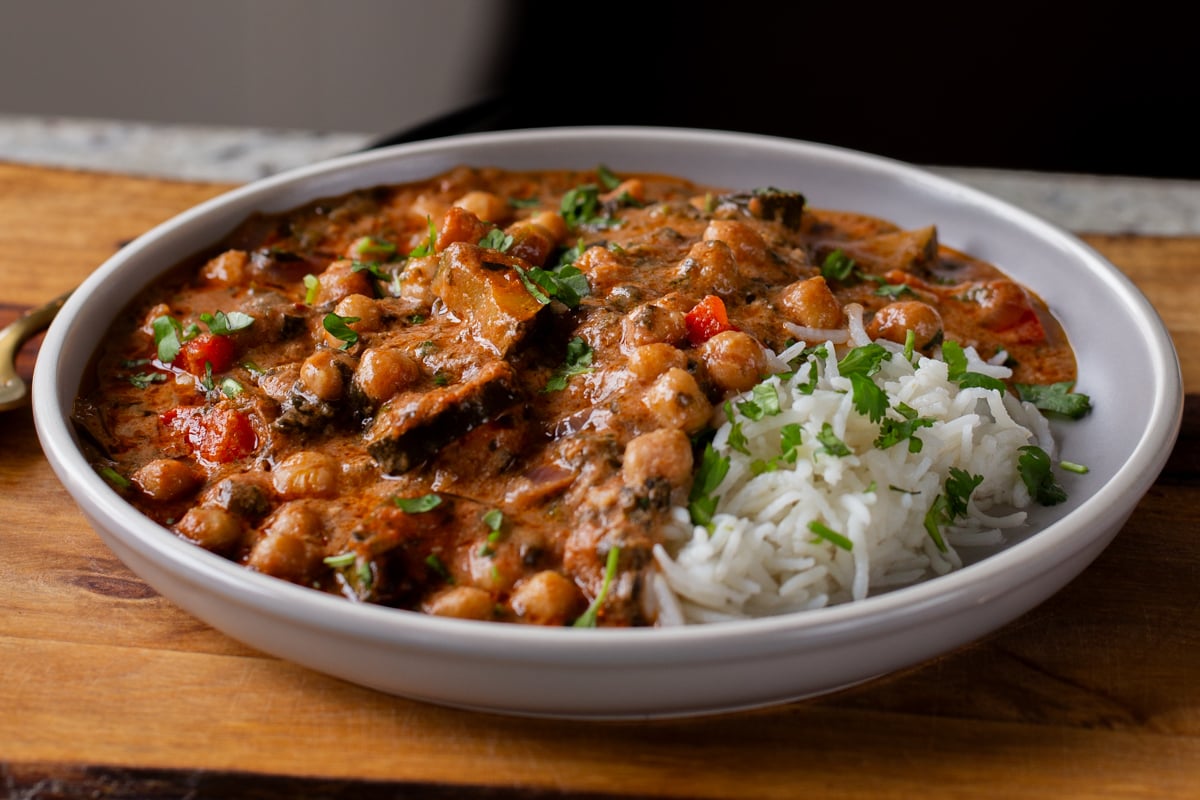 chickpea zucchini curry in a bowl with rice