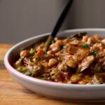 chickpea zucchini curry in a bowl with a spoon