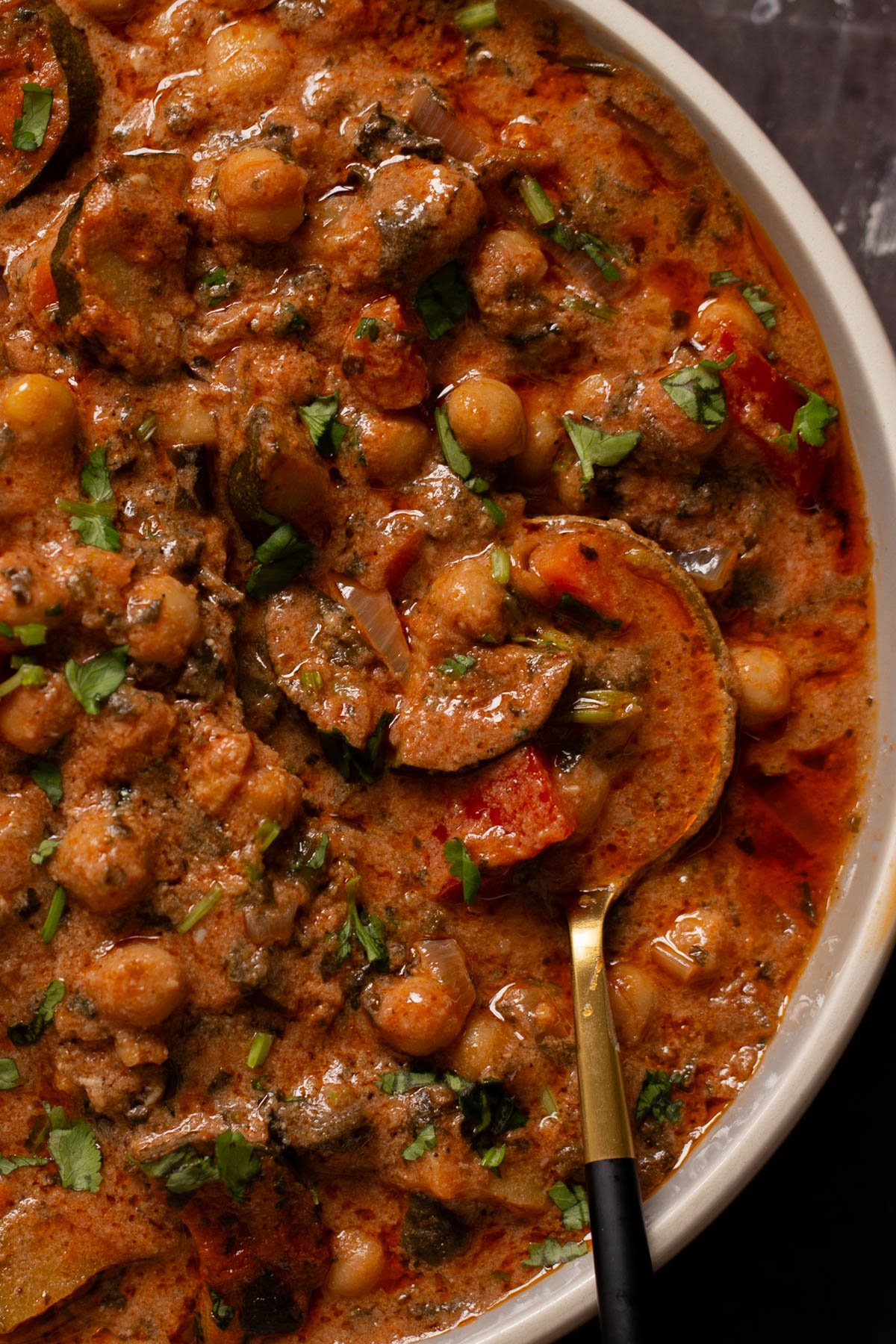close-up of zucchini chickpea curry in a bowl