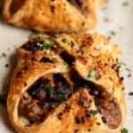 side angle of mushroom puffs on a baking sheet, so you can see more of the filing
