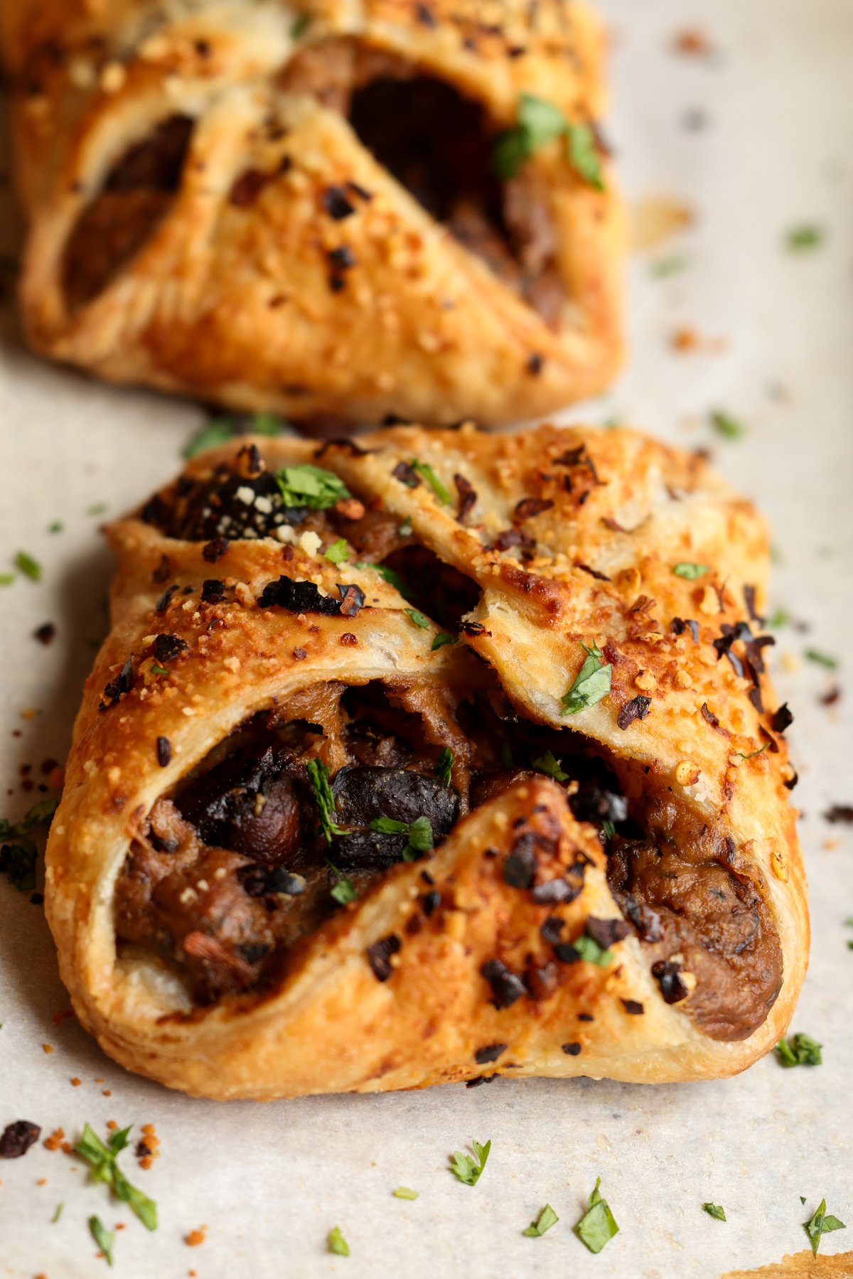 side angle of mushroom puffs on a baking sheet, so you can see more of the filing