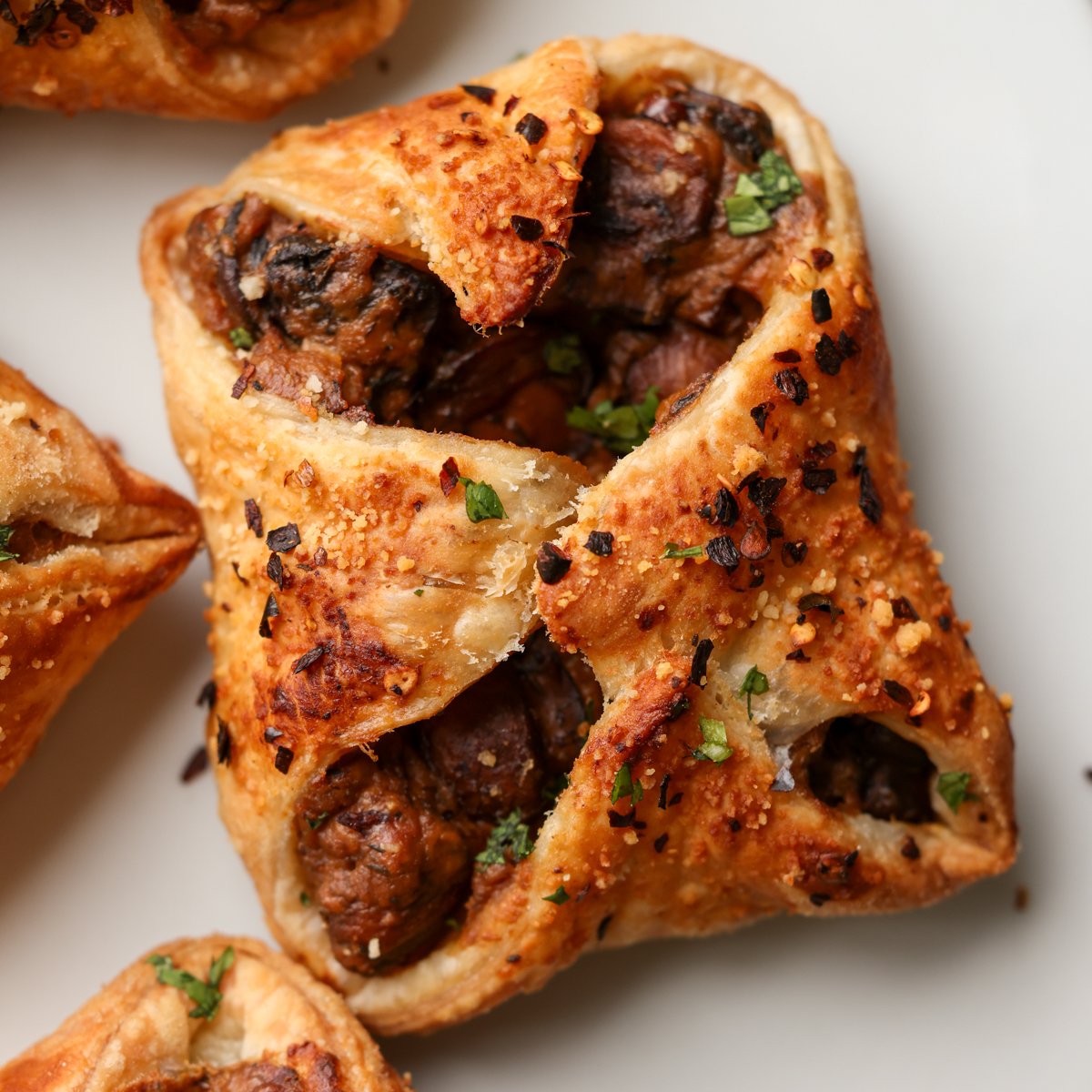 close-up of mushroom puffs on a white serving plate