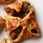 close-up of mushroom puffs on a white serving plate
