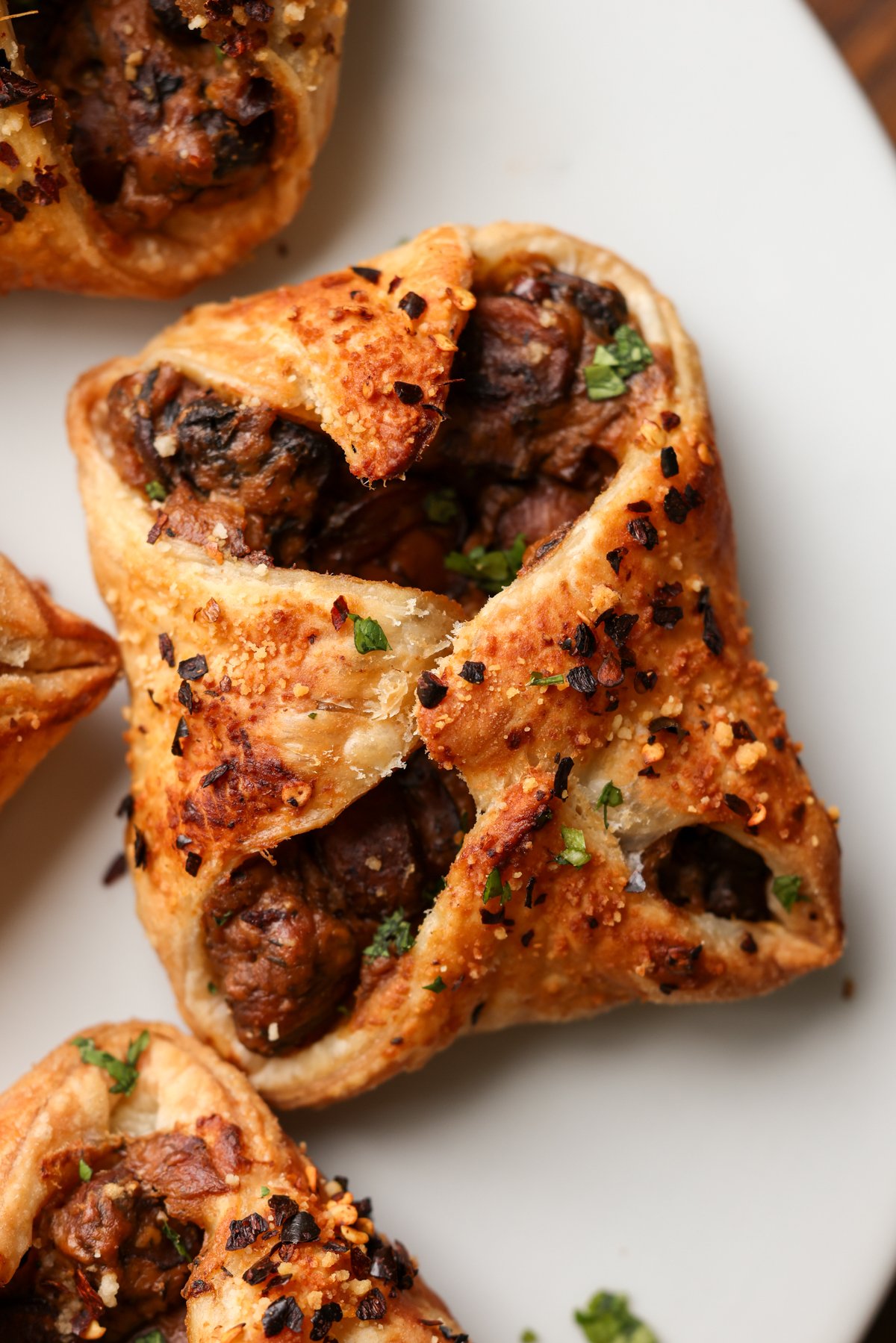 close-up of mushroom puffs on a white serving plate