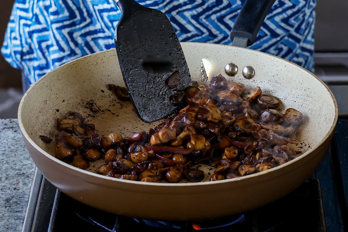 stirring the mushrooms