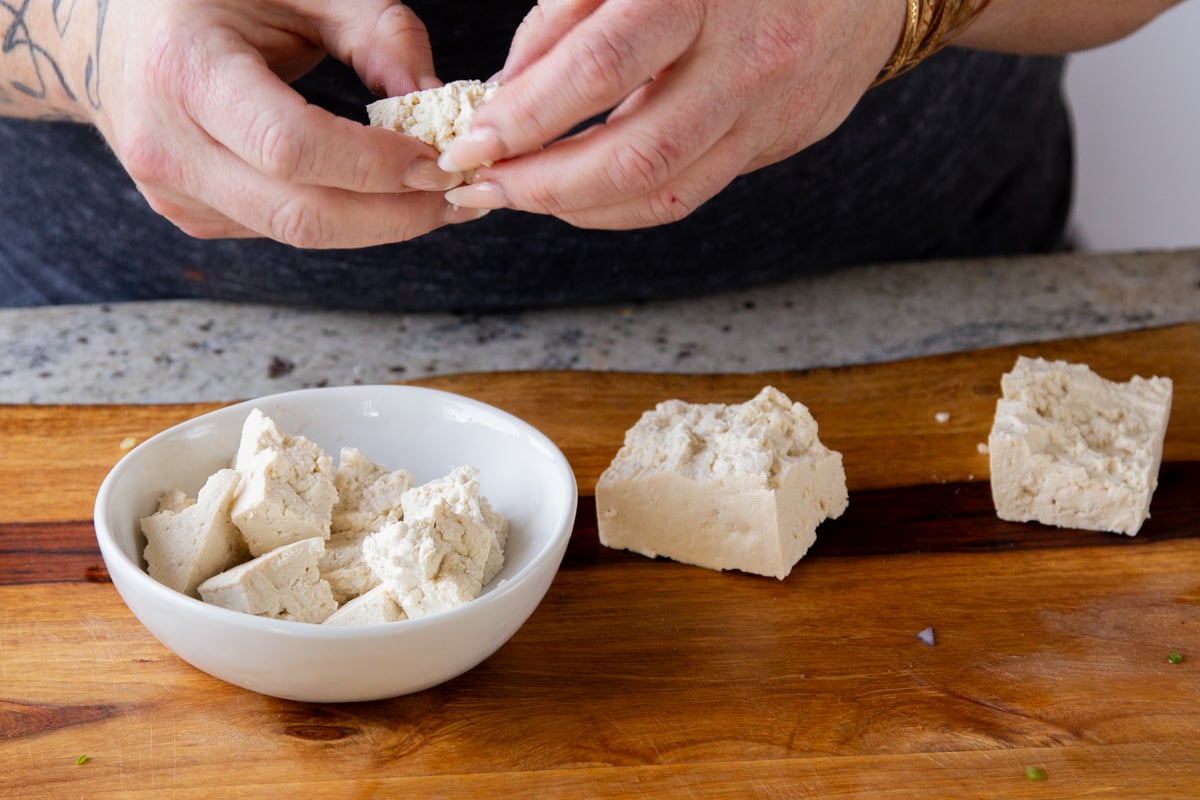 tearing tofu into pieces
