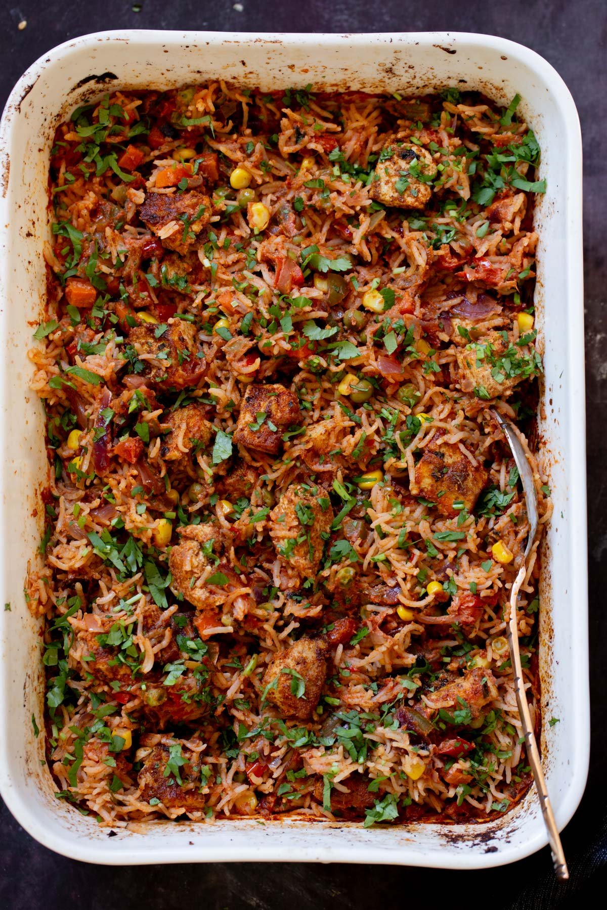 tikka masala rice in the baking pan after baking and fluffing