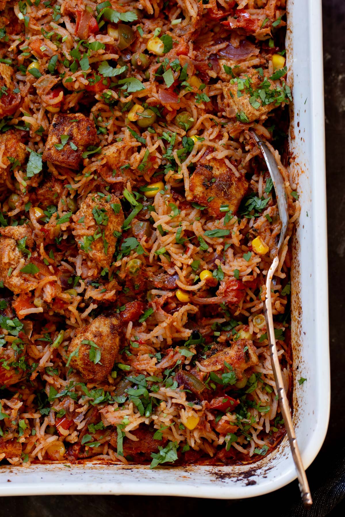 close-up of tikka masala rice in the baking pan after baking and fluffing