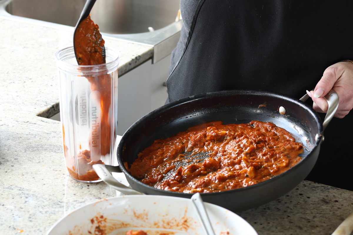 transferring the sauce to a blender