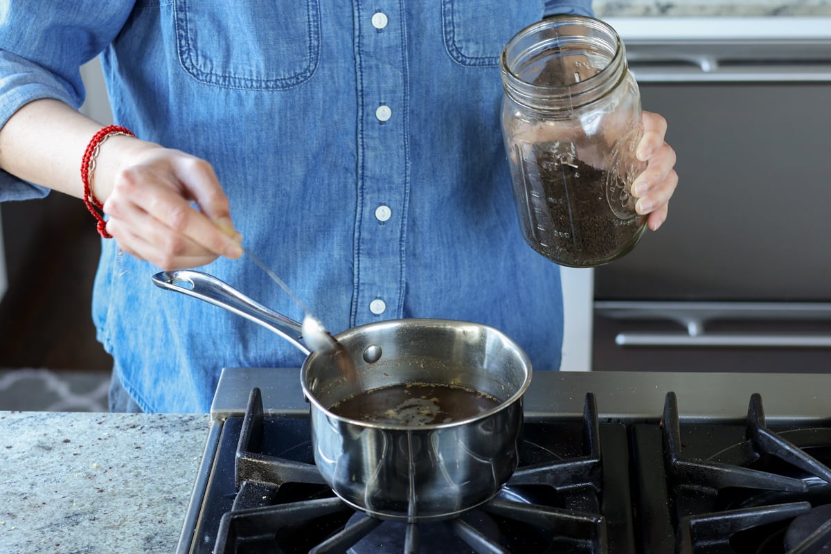 adding tea to the pan