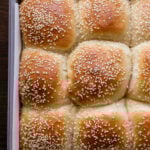overhead photo of fluffy dinner rolls in the baking pan