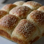 fluffy dinner rolls on a serving tray before pulling apart