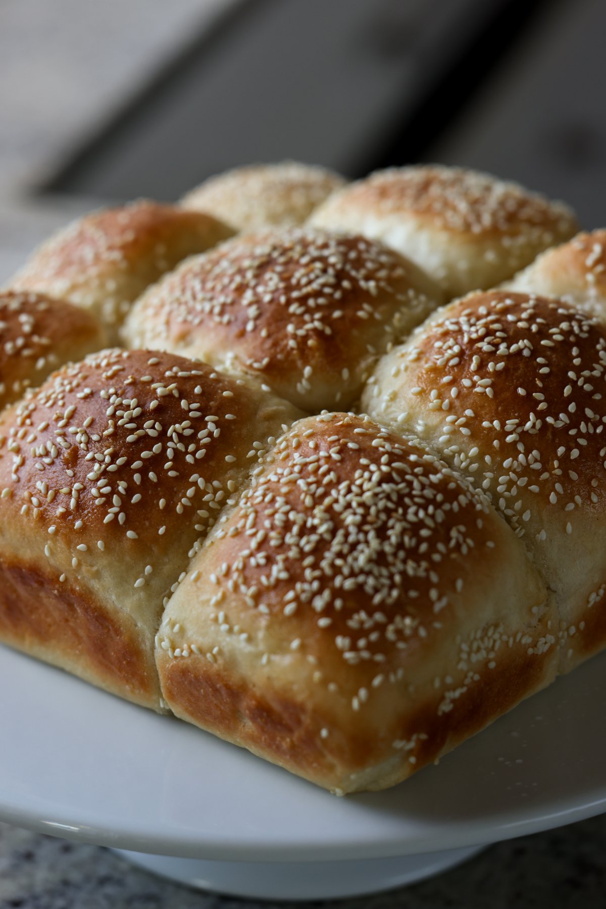 fluffy dinner rolls on a serving tray before pulling apart