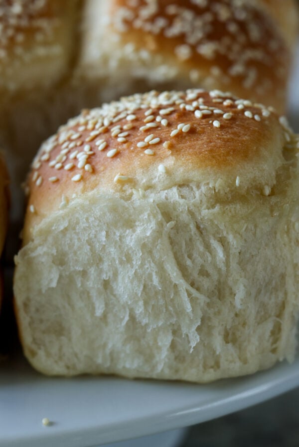 fluffy dinner rolls on a serving tray after pulling apart