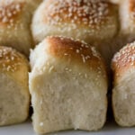 fluffy dinner rolls on a serving tray after pulling apart