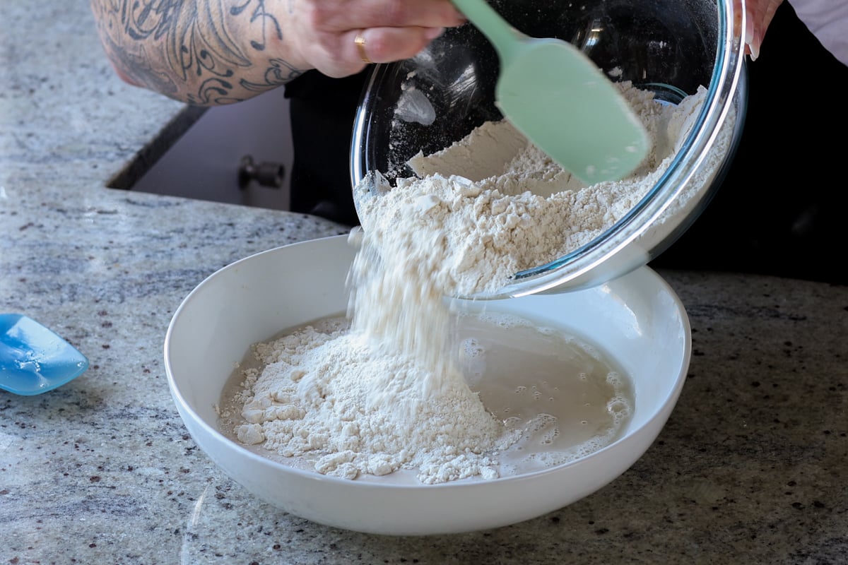 adding dry ingredients to the yeast mixture