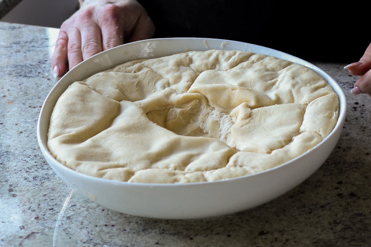 dough in the bowl after rising and punching down