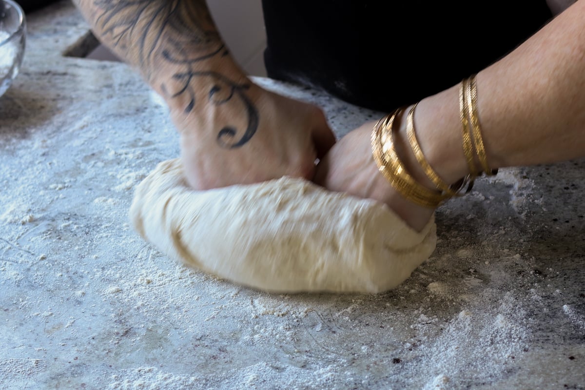 folding the dough to shape it