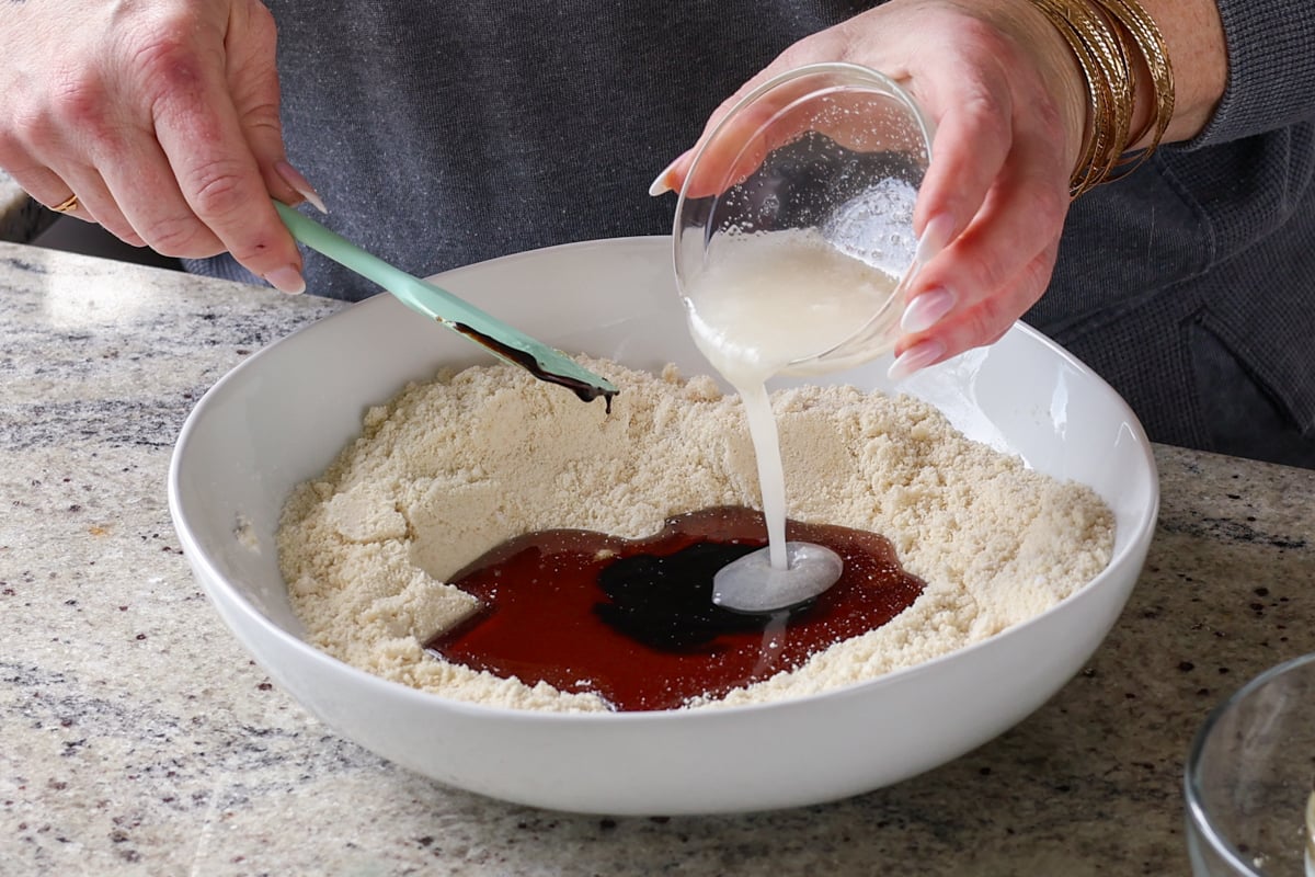 adding wet ingredients to the dry