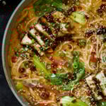 close-up of a panful of creamy tahini ramen with teriyaki tofu on top