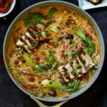 panful of creamy tahini ramen with teriyaki tofu on top