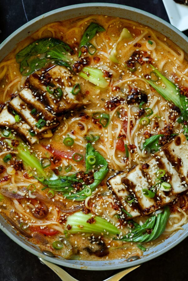 panful of creamy tahini ramen with teriyaki tofu on top