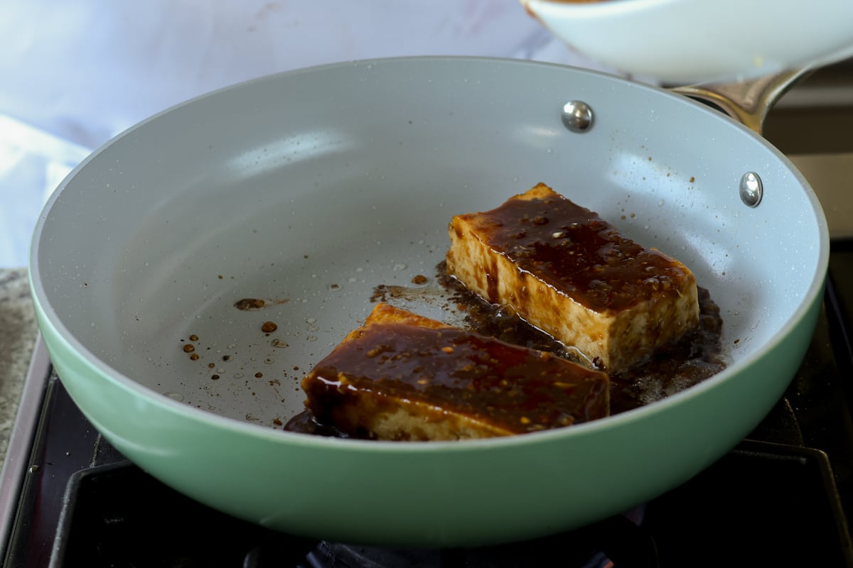 teriyaki tofu in the pan after adding more sauce