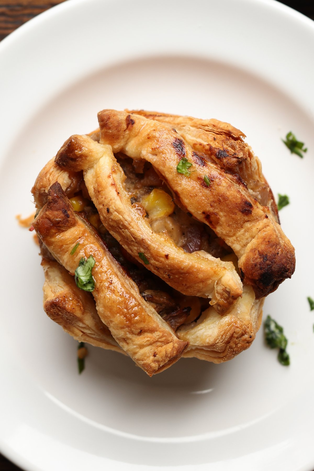 mini pot pie with a simple crust on a plate
