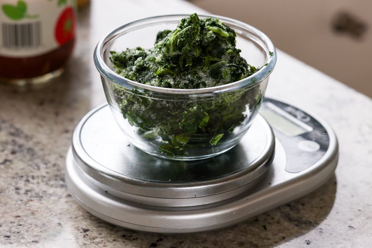 weighing the spinach