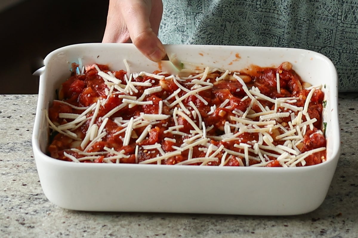 adding toppings to the pan