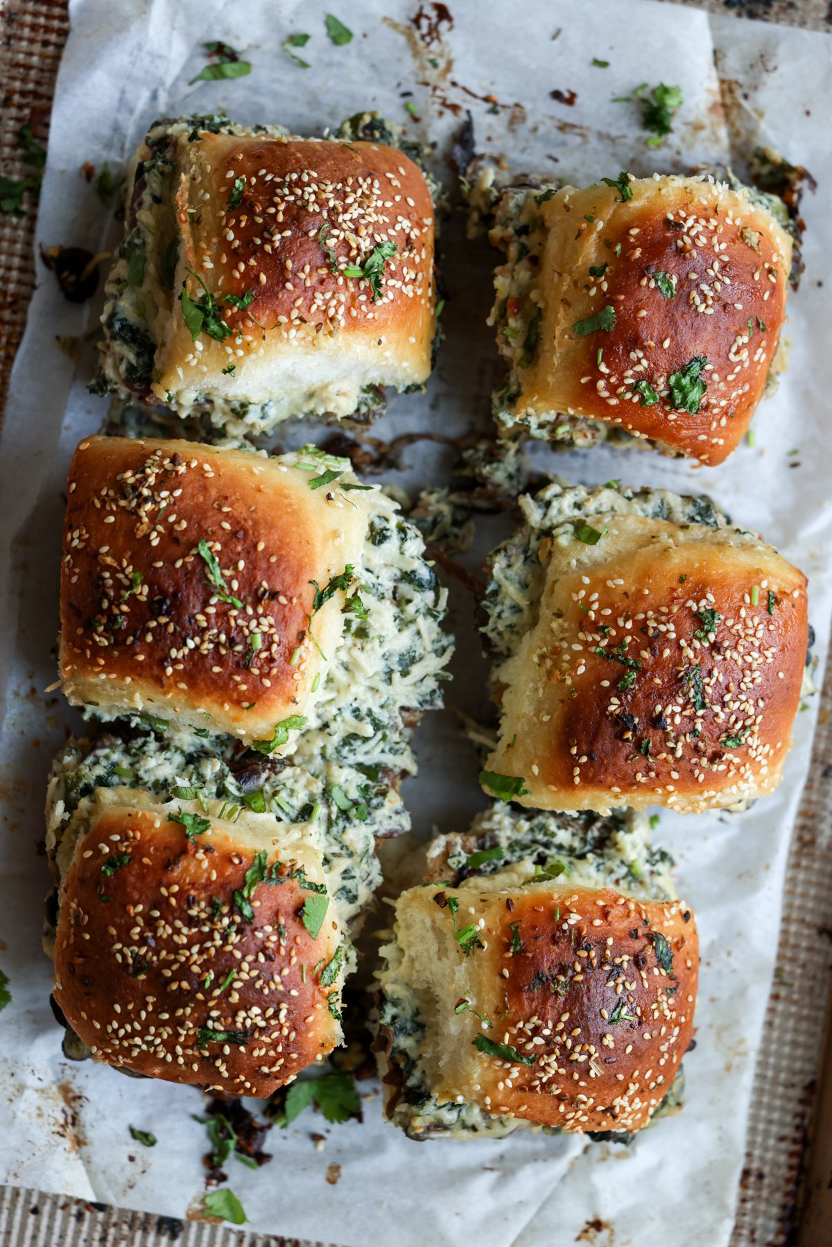 cheesy mushroom sliders on the baking sheet after baking