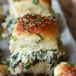close-up of cheesy mushroom sliders on the baking sheet after baking