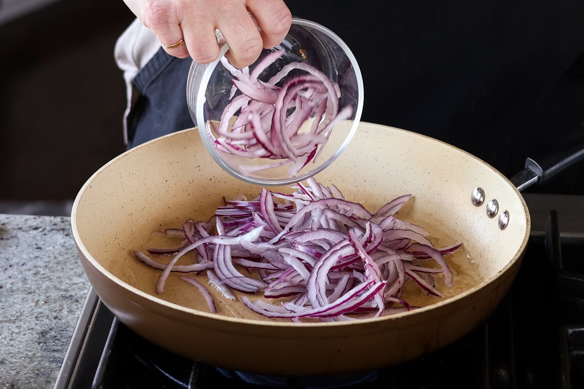 adding onion to the pan