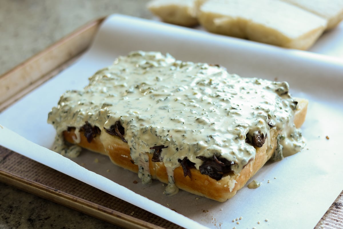 mushroom sliders covered in spinach mixture
