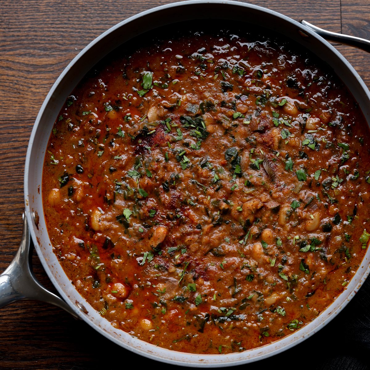 lentil bean stew in the pan after cooking and garnishing