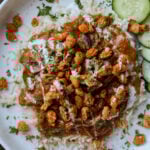 balchao mushrooms over rice topped with crispy beans