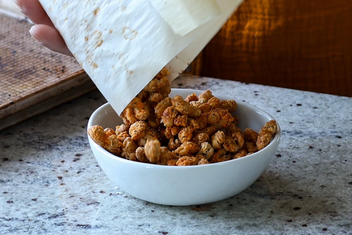 transferring crispy beans to a bowl