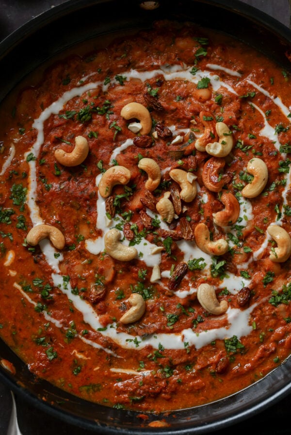 beans korma in the pan topped with cashews