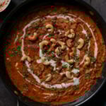 beans korma in the pan topped with cashews