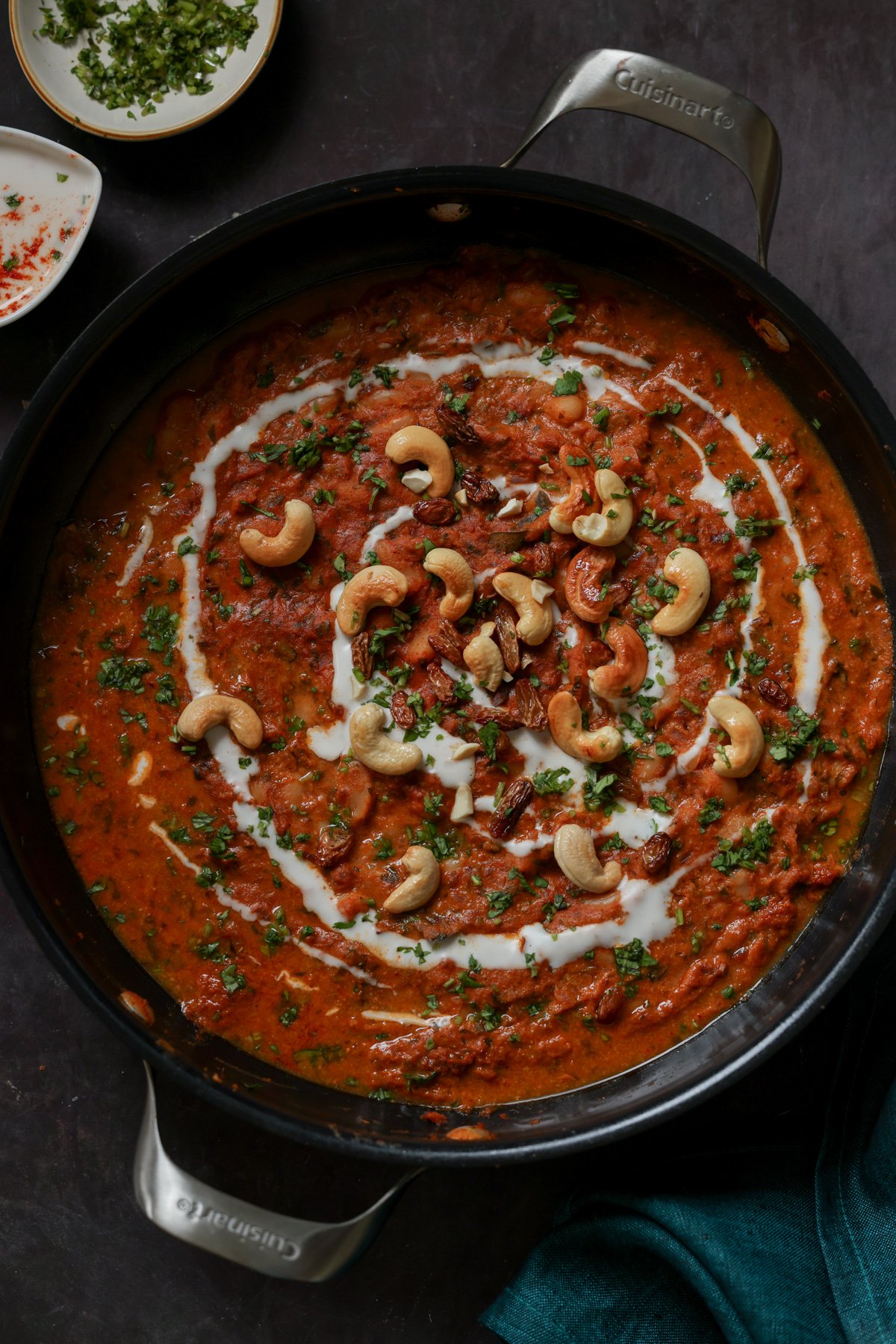 beans korma in the pan topped with cashews