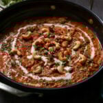 beans korma in the pan topped with cashews