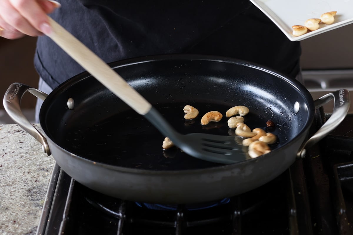 toasting cashews and raisins in the pan