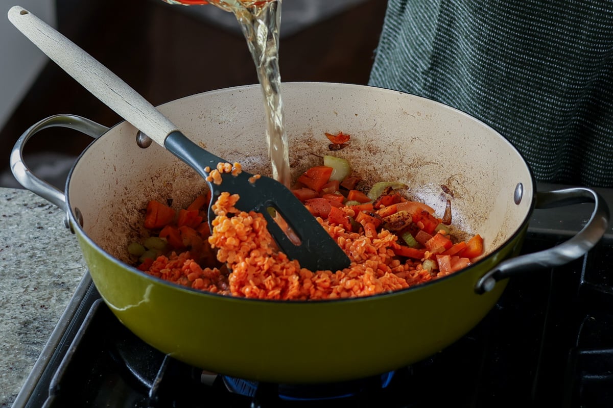 adding stock to the pan