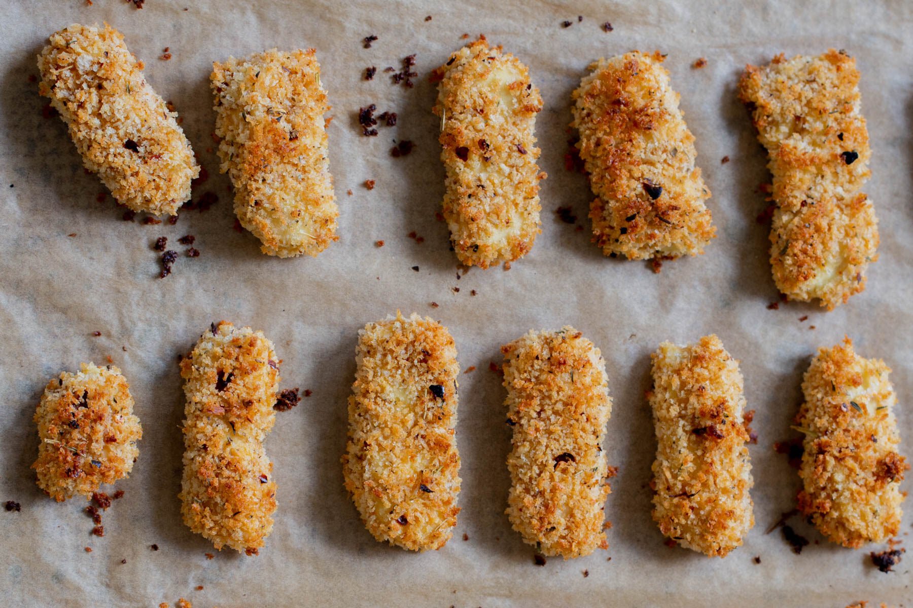 vegan mozzarella sticks on the baking sheet after baking