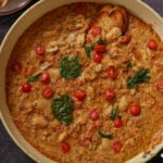 sicilian pesto sauce butter beans in the pan topped with crispy basil