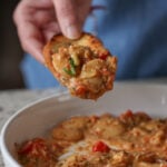 a piece of bread dipped into Sicilian pesto sauce butter beans