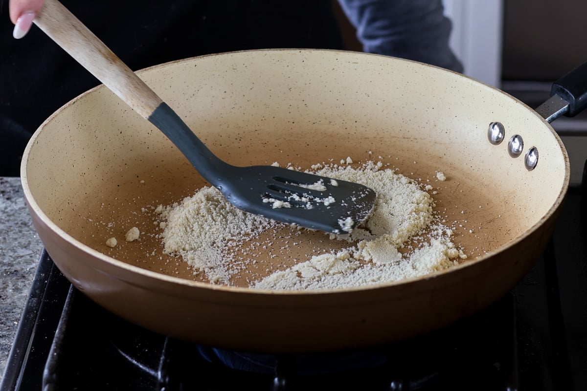 Adding almond flour to the pan
